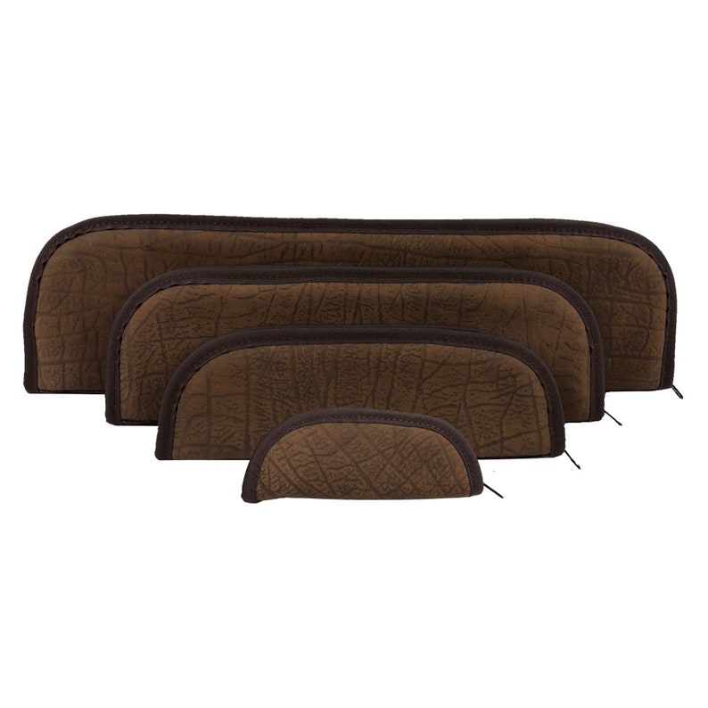 May include: A set of five brown, textured, semi-circular cases, each with a dark brown trim and zipper. The cases vary in size, stacked from largest to smallest, creating a layered effect. The material has a pattern resembling elephant skin.