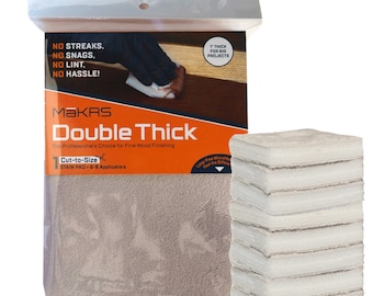 May include: A package of 6-8 Makrs Double Thick Cut-to-Size Stain Pads. The package is orange and white and says "The Professional's Choice for Fine Wood Finishing". The pads are white and are shown stacked on top of each other.