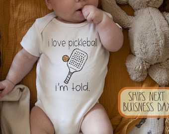 I Love Pickleball I'm Told Baby Onesie® Brand: Funny Sports Fan Baby Bodysuit