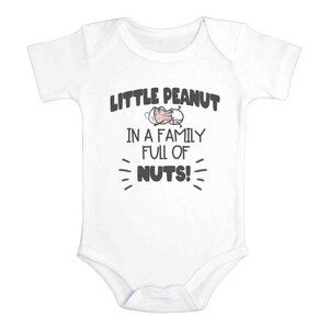 May include: White baby onesie with a black graphic that says "Little Peanut in a family full of nuts!" with a cartoon peanut baby on the onesie.