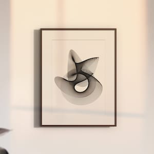 May include: A framed abstract art print featuring a black and white design of overlapping shapes. The print is in a simple brown frame and is hanging on a white wall.