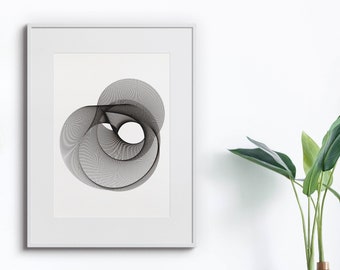 May include: A black and white abstract geometric design print in a white frame. The print features a series of overlapping circles and lines creating a swirling effect.