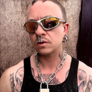 PADLOCK SEPTUM RINGS in stock now. Stainless steel with hinge fixture. Designed to fit regular pierced septum or for stacking. Hangs low.