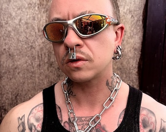 PADLOCK SEPTUM RINGS in stock now. Stainless steel with hinge fixture. Designed to fit regular pierced septum or for stacking. Hangs low.
