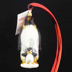 Emperor Penguins Glass Ornament