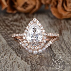 Pear shaped diamond ring with rose gold band clearance