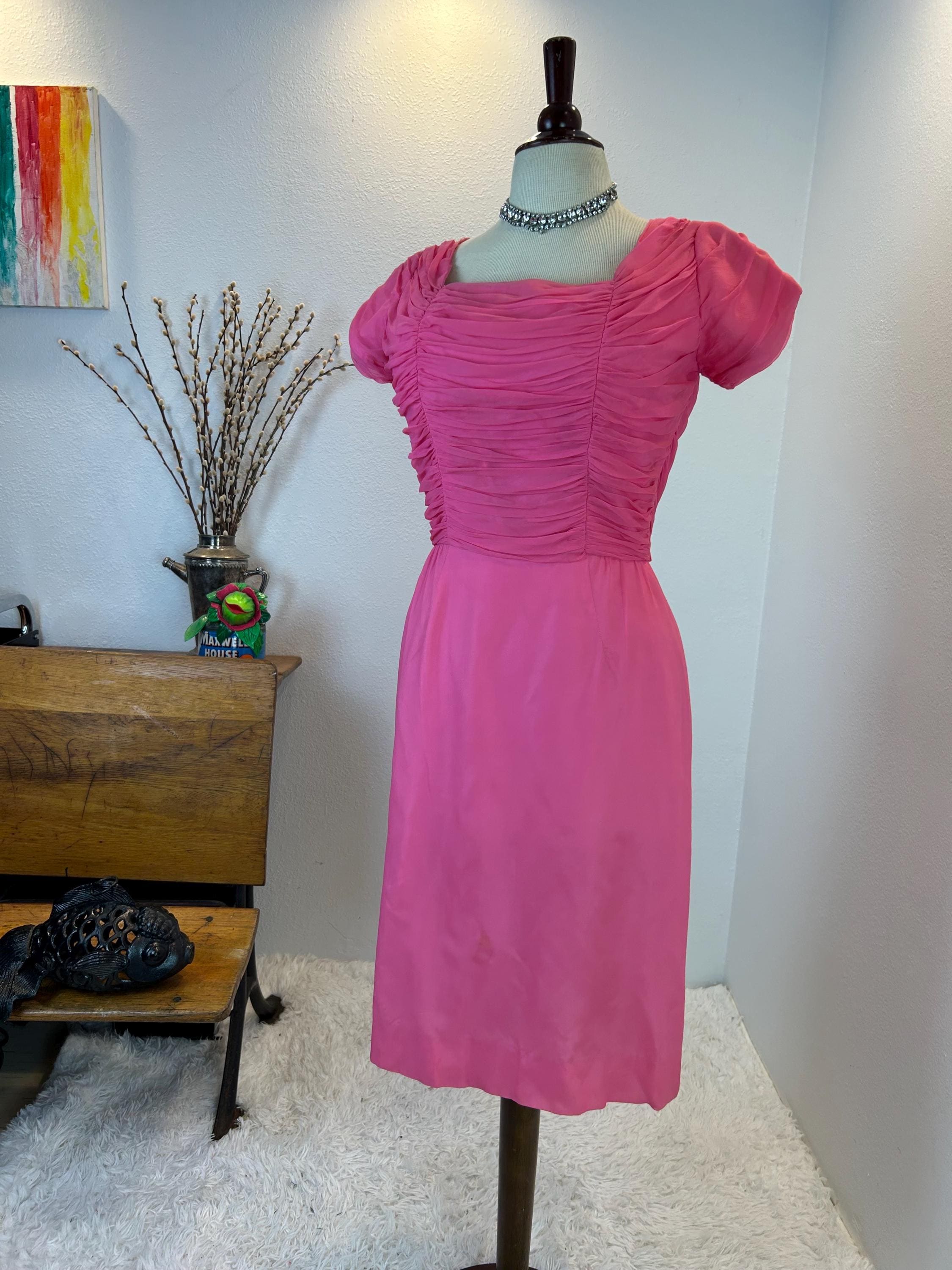 1950s pink chiffon dress  1950s Dreamiest dress! Very sweet pink empire waist gown  Fully  lined chiffon, satin ribbon bustline with embroidered floral detail for a  little pop of color ..  26W / Reduced