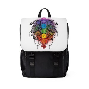 May include: Black backpack with a white front panel featuring a colorful mandala design with seven chakras. The mandala is surrounded by a black floral design.