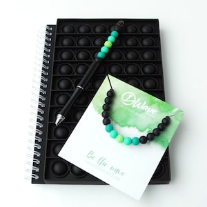 Silicone Pop It Gift Set (Black) | Notebook, Beaded Pen & Bracelet | Fidget | Sensory | Stress Relief | Supports Mental Health