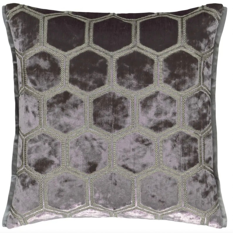 May include: A gray velvet pillow with a hexagonal pattern embroidered in silver thread.