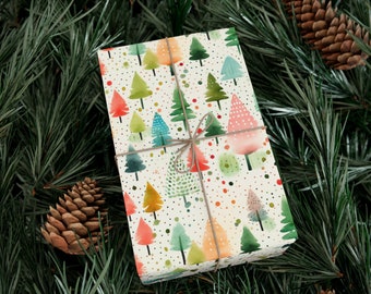 May include: A white gift wrap with a repeating pattern of colorful watercolor Christmas trees and white polka dots. The gift wrap is tied with a brown twine bow.