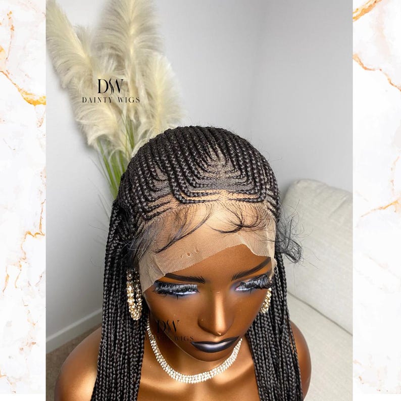May include: A black braided wig with a lace front. The wig features intricate cornrow braids and is styled on a mannequin head. The brand name "DSW DAINTY WIGS" is visible on the mannequin. The wig is designed to mimic a natural hairline.