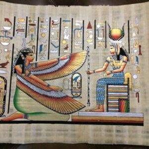 May include: A papyrus painting depicting two figures in ancient Egyptian attire. One figure kneels with outstretched, detailed wings, while the other sits on a throne. The artwork features hieroglyphs and vibrant colors, including gold, blue, and green.