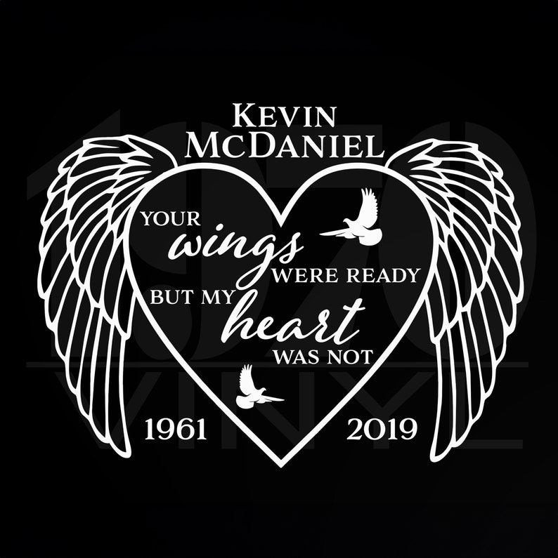 May include: Black and white graphic design with a heart shape and wings. The text reads "Your wings were ready but my heart was not."  The names "Kevin McDaniel" and the years "1961" and "2019" are also included.