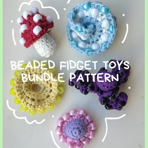 May include: A collection of handmade beaded fidget toys in various shapes and colors. Includes a red mushroom, a blue spiral, a yellow flower, a purple shape, and a pink flower. The text "BEADED FIDGET TOYS BUNDLE PATTERN" is also visible.