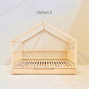 May include: A wooden house-shaped bed frame with a slatted mattress and a pull-out drawer. The bed frame is made of natural wood and has a simple, modern design. Option 5.
