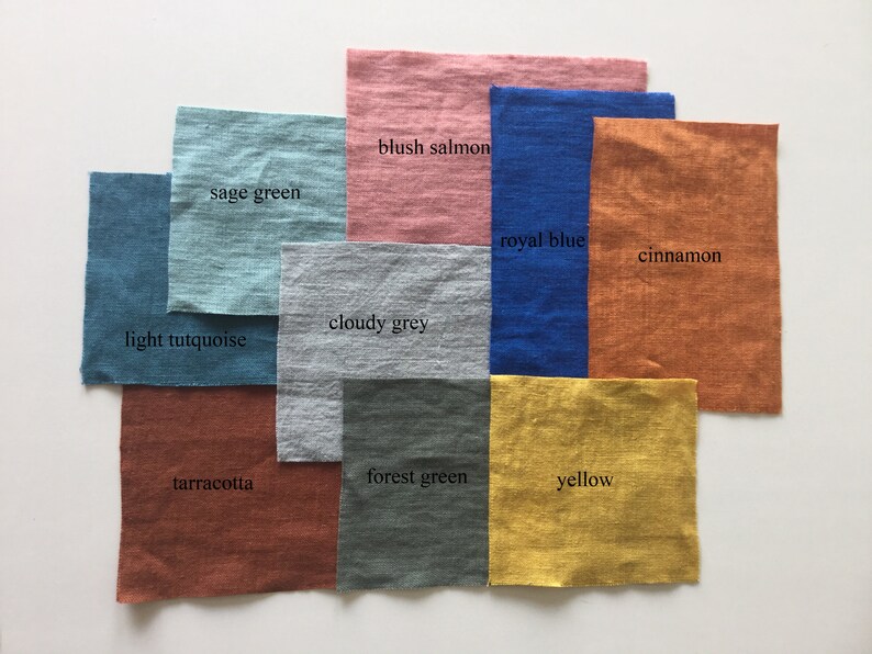 May include: A collection of fabric swatches in various colors, including sage green, blush salmon, royal blue, cinnamon, cloudy grey, light turquoise, terracotta, forest green, and yellow.