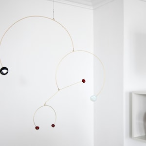 Kinetic mobile in opalite, obsidian and bamboo coral stones