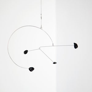 Small kinetic mobile in black tourmaline and stainless steel, an ideal gift for interior decoration