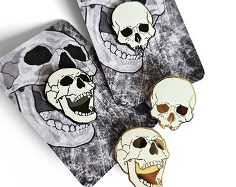 Human skull pins black & gold enamel pin badge