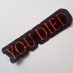 Autocollant You Died en vinyle holographique pour jeu vidéo