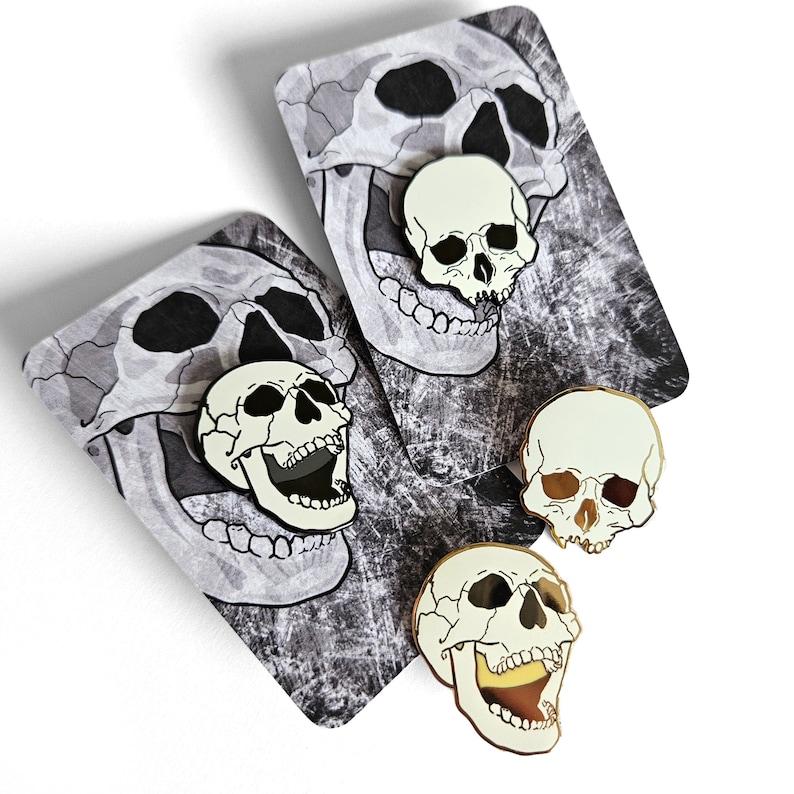 Human skull pins black & gold enamel pin badge