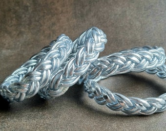 Double braided, shiny silver Buddhist bangle
