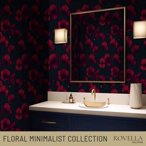 May include: A bathroom featuring dark blue cabinets, a white countertop, and a gold-framed mirror. The walls are adorned with wallpaper displaying a pattern of red poppies on a dark backdrop. The text "FLORAL MINIMALIST COLLECTION" and "ROVELLA WALLPAPER" are visible.