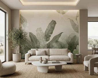 May include: A modern living room with a beige sofa, a white oval coffee table, and two armchairs. A large mural of green banana leaves adorns the wall. A potted olive tree and a woven rug complete the decor.