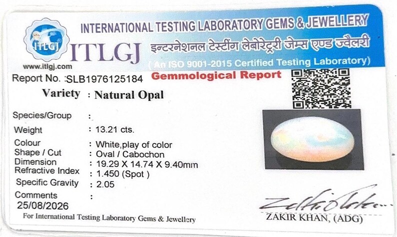 May include: A white gemological report card from International Testing Laboratory Gems & Jewellery for a natural opal. The card displays report number SLB1976125184, a QR code, a photo of an oval cabochon opal, and technical data including 13.21 cts weight.