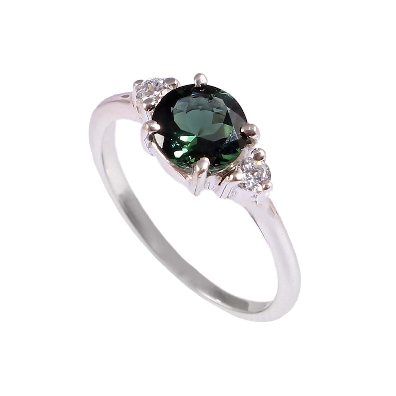 Natural green tourmaline solitaire ring in 925 sterling silver set inside a velvet ring display box.