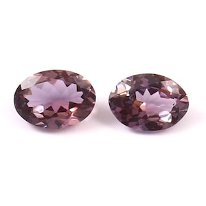 Pair of two matching cushion cut natural purple tanzanite loose gemstones,