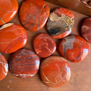 Earthy Red Jasper Pebble - A tactile touchstone for grounding energy.