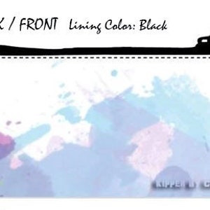 May include: A white zippered pouch with a colorful watercolor design of blue, pink, and yellow paint splatters. The pouch has a black zipper and the text "Kipper & Chad" is printed on the bottom right corner.