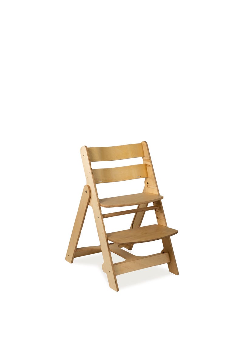 May include: A wooden high chair with a natural finish. The chair has a stepped design with a seat and footrest. The backrest has three horizontal slats. The chair is designed for children and is made of light-colored wood.
