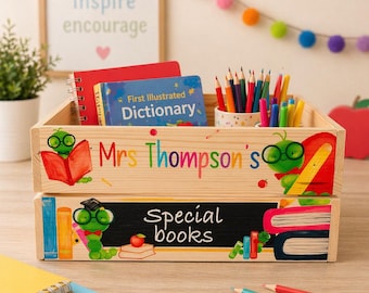 May include: Wooden storage crate with the text "Mrs Thompson's" and "Special books". The crate contains books, pencils, and a dictionary. The crate is decorated with colorful illustrations of a worm wearing glasses.