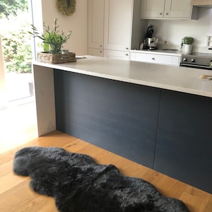 Ethically crafted double sheepskin rug in dark grey