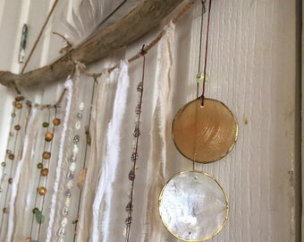 Driftwood and shell hanging mobile. Made from a beautiful selection of driftwood, shells, beads, cords, lace, ribbon. 40x 50cm. Stunning.