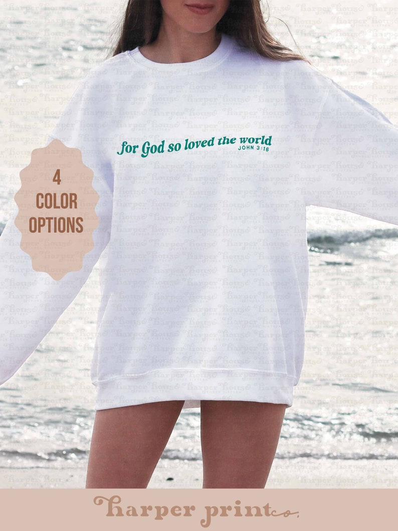 May include: White sweatshirt with the text "For God so loved the world" in green lettering and the scripture reference "John 3:16" in smaller font below.