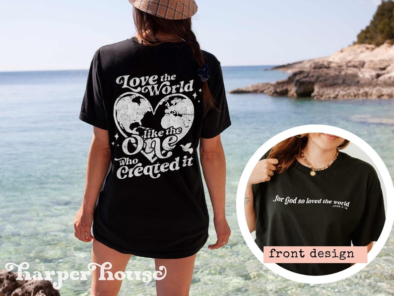 May include: Black t-shirt with a white graphic print of a heart with a world map inside and the text "Love the World like the One who Created it". The front of the shirt has the text "for God so loved the world" in white.