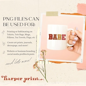May include: A white ceramic mug with the word "BABE" in colourful letters. The mug is being held by a hand with light pink nail polish. The image is surrounded by pink and beige paper with a floral design.