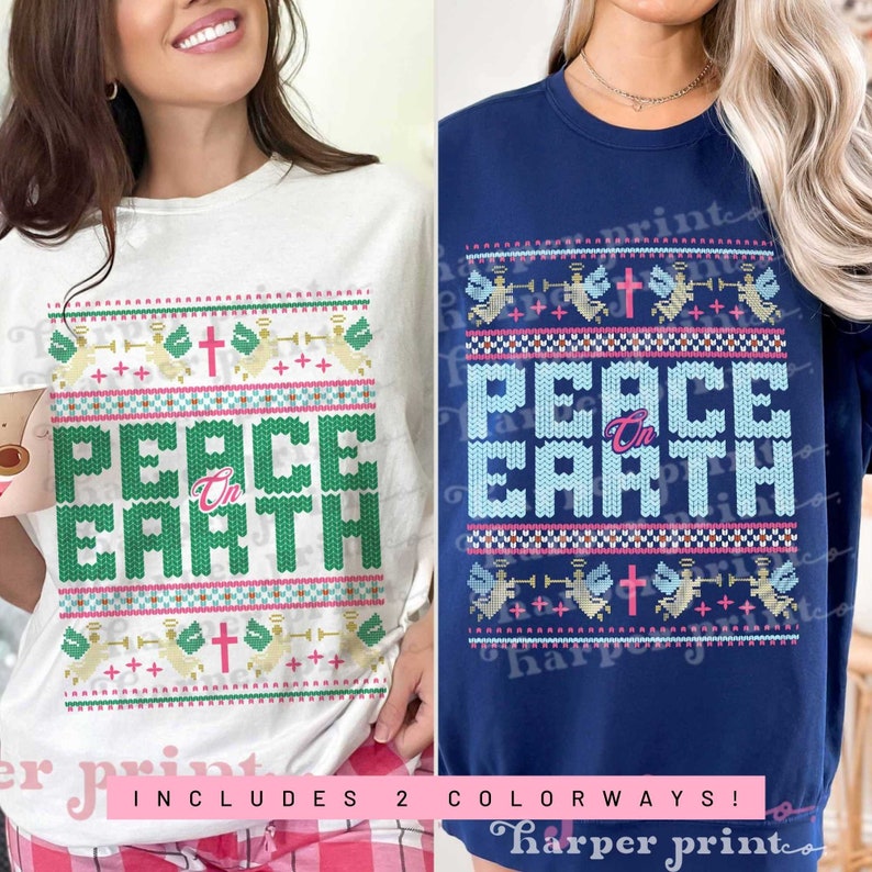 May include: Two Christmas-themed t-shirts with a white and a navy blue background. Both shirts feature a knitted pattern with the words "Peace on Earth" in pink and green letters. The pattern also includes angels, crosses, and stars.