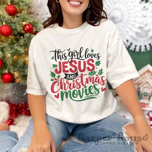 May include: White t-shirt with a green and red graphic that says "This girl loves Jesus and Christmas movies".