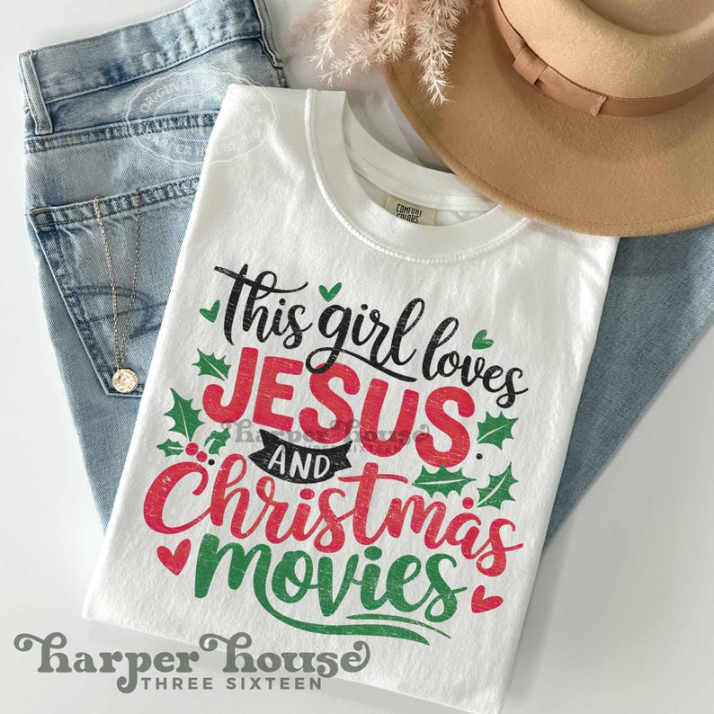 May include: White t-shirt with a red and green graphic that says "This girl loves Jesus and Christmas movies". The graphic has a distressed look and is surrounded by green holly leaves.