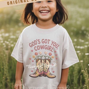 God's got you, cowgirl png western tshirt designs girls toddler png