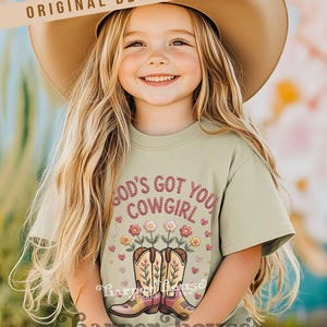 God's got you, cowgirl png western tshirt designs girls toddler png