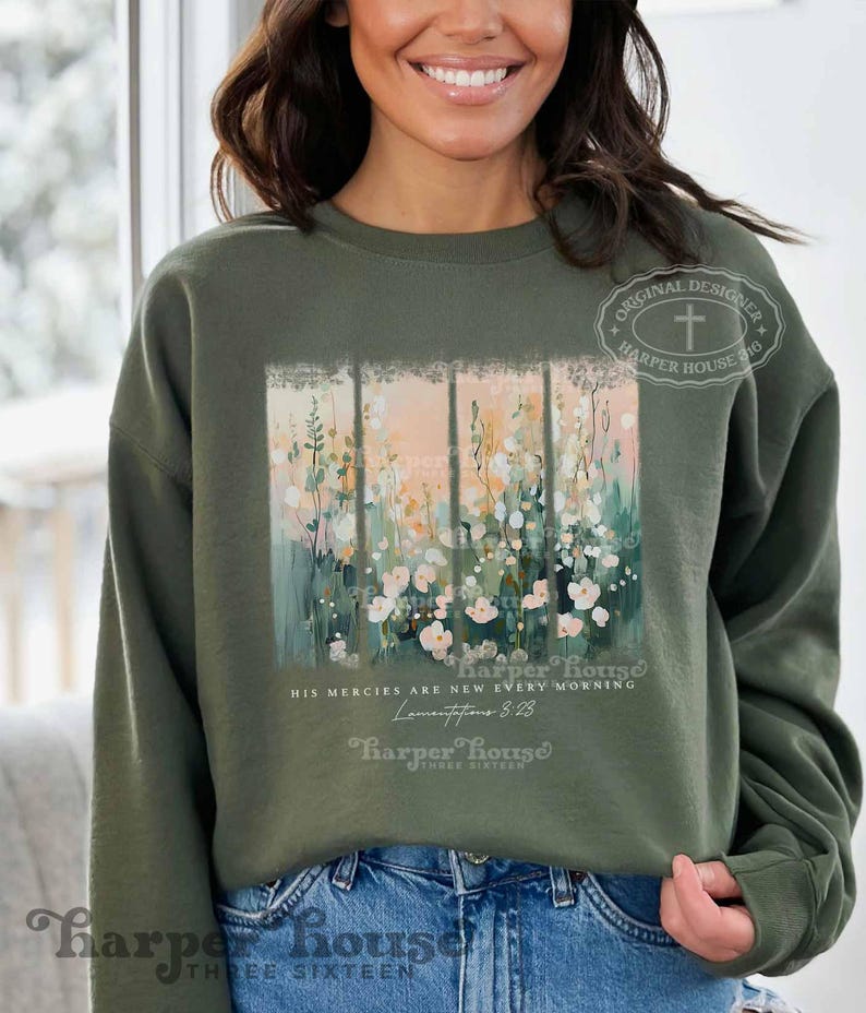 May include: A green sweatshirt with a floral design and the text "His mercies are new every morning" and "Lamentations 3:23". The sweatshirt also has the text "Harper House" and "Three Sixteen" on it.