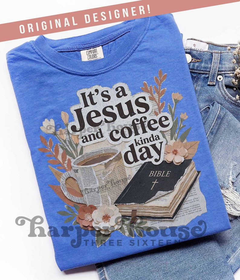 May include: A blue t-shirt with the text "It's a Jesus and coffee kinda day" and a graphic of a coffee cup, a Bible, and flowers. The shirt is folded on top of a pair of blue jeans.