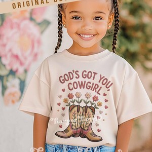 God's got you, cowgirl png western tshirt designs girls toddler png