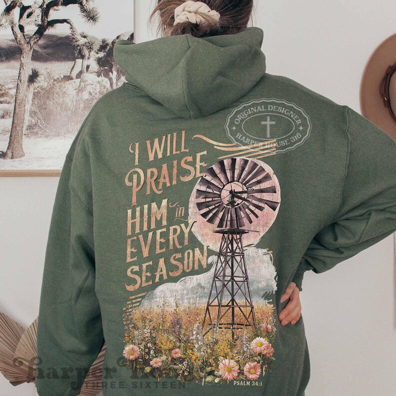 May include: Green hooded sweatshirt with a vintage-style graphic of a windmill and the text "I will praise him in every season" and "Psalm 34:1".